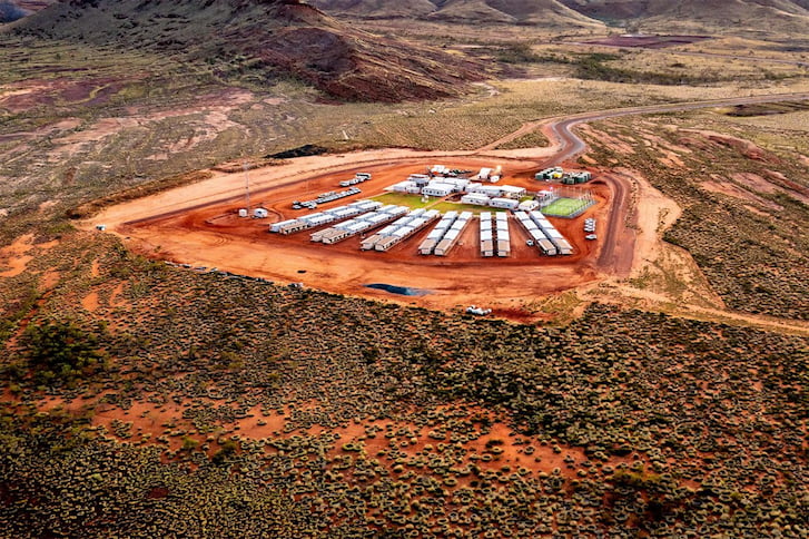 Aerial view of a mine camp building site in the desert landscape.