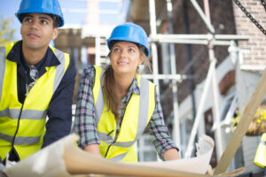 two trainees on building site