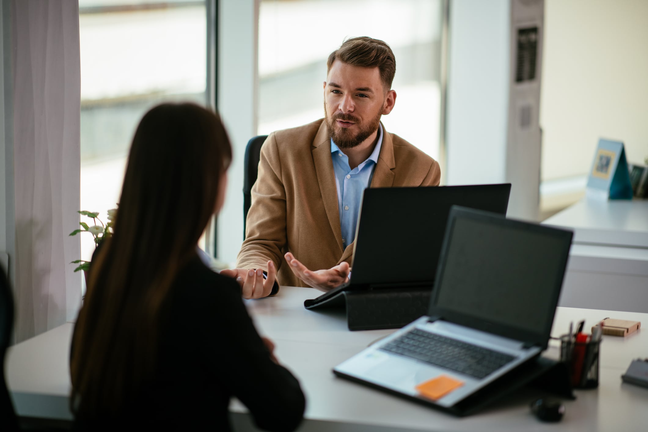 Colleagues talking to each other in the office.