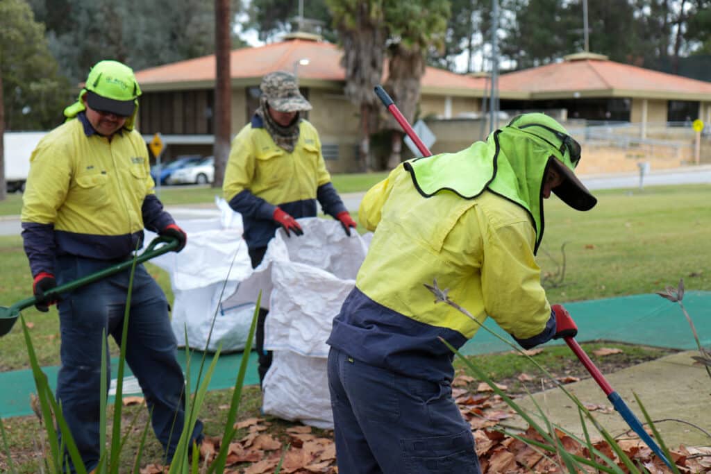 genU workers on location doing gardening work.