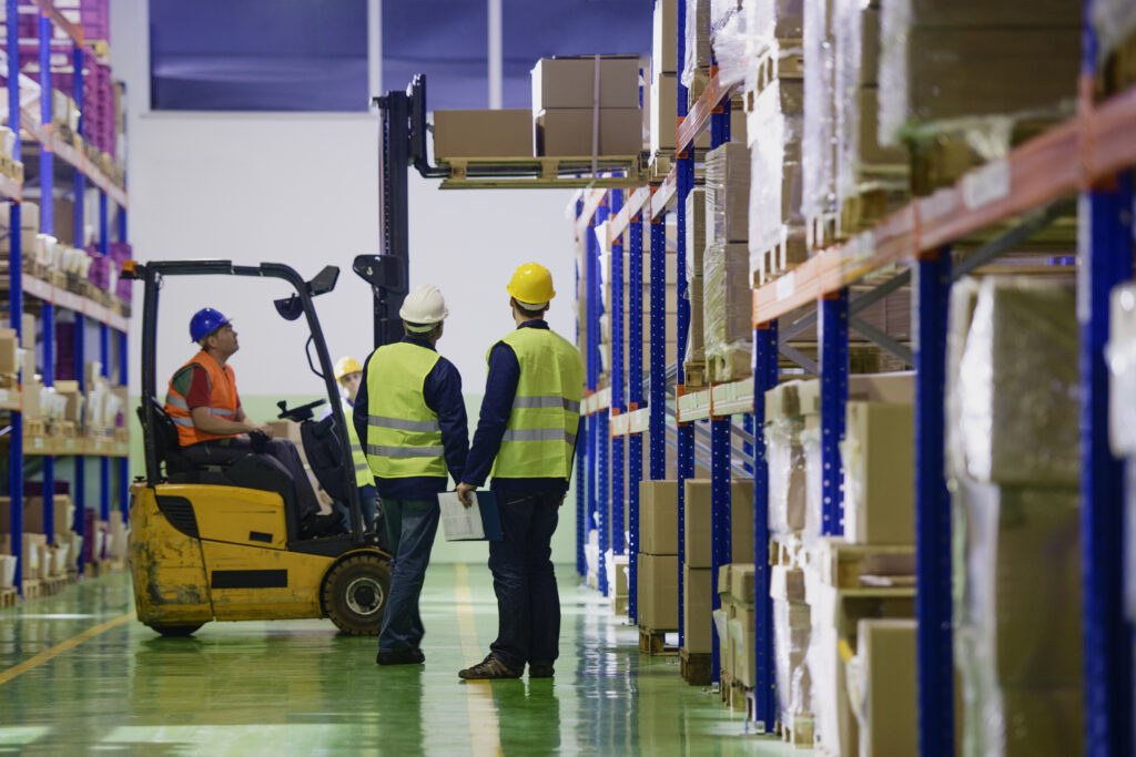 Warehouse employees doing an inventory in the warehouse.