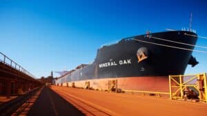 Western Australian iron ore operations in the Pilbara. Loading iron ore to a ship.