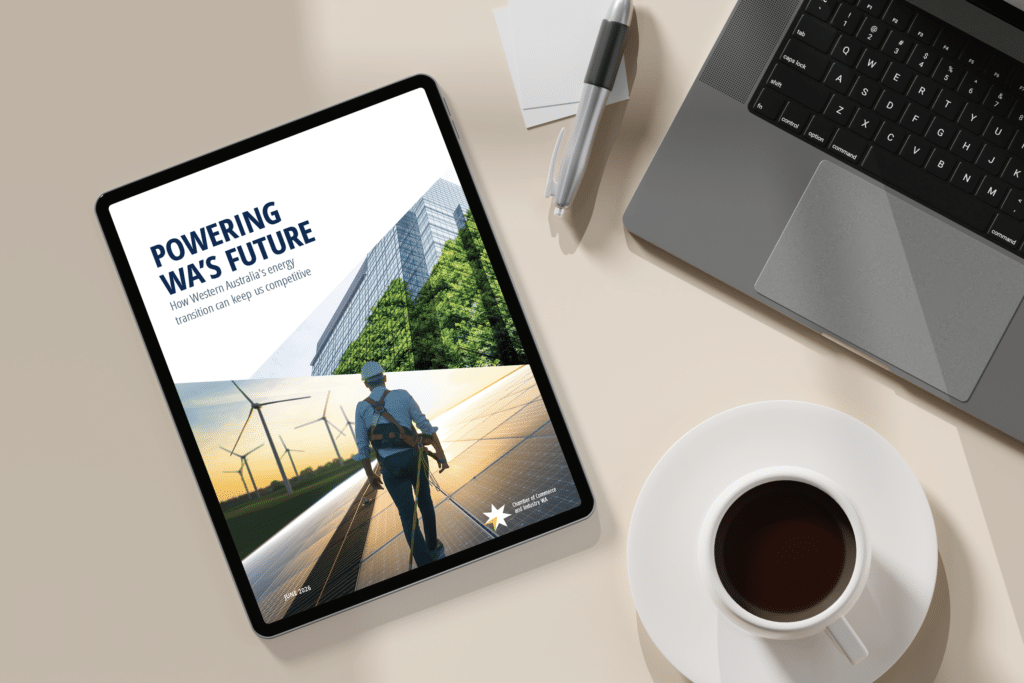 CCIWA’s Powering WA’s Future energy transition report displayed on a tablet beside a laptop, highlighting Western Australia’s energy future and competitiveness.