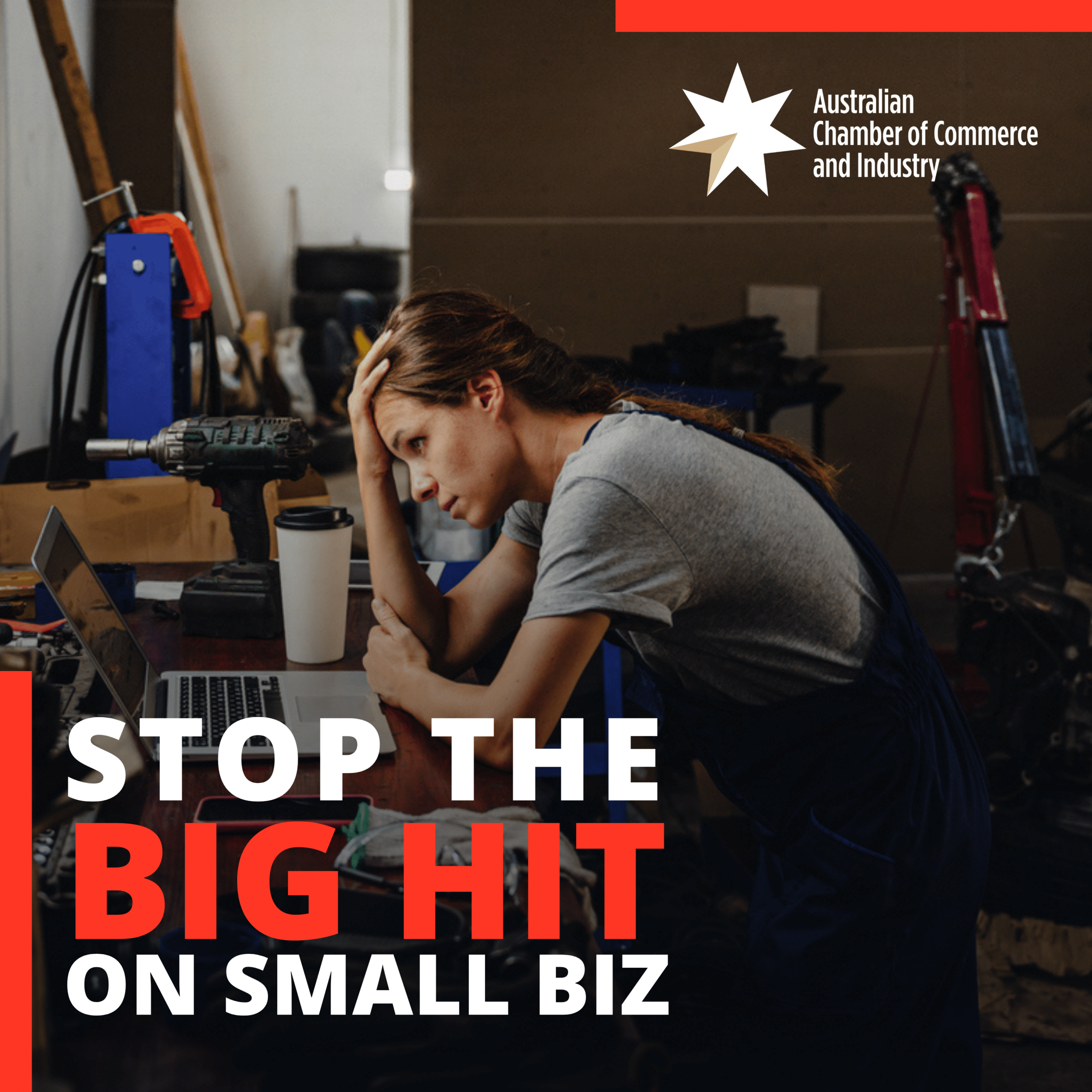 Small business owner looking concerned at her workstation, with Australian Chamber of Commerce and Industry’s “Stop the Big Hit on Small Biz” campaign message.