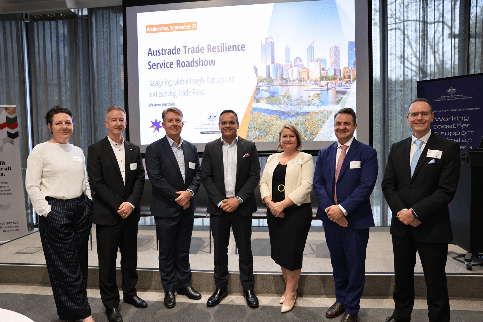 Seven event business people pose at the Austrade Trade Resilience Service Roadshow in Perth.