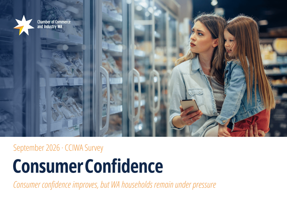 Retail employee using a tablet to check stock on shelves in a small business store, representing workplace compliance and employment standards in the retail sector.